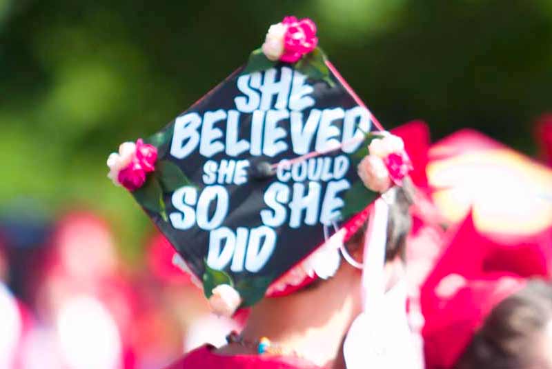 Graduate with grad cap that says She believed she could so she did